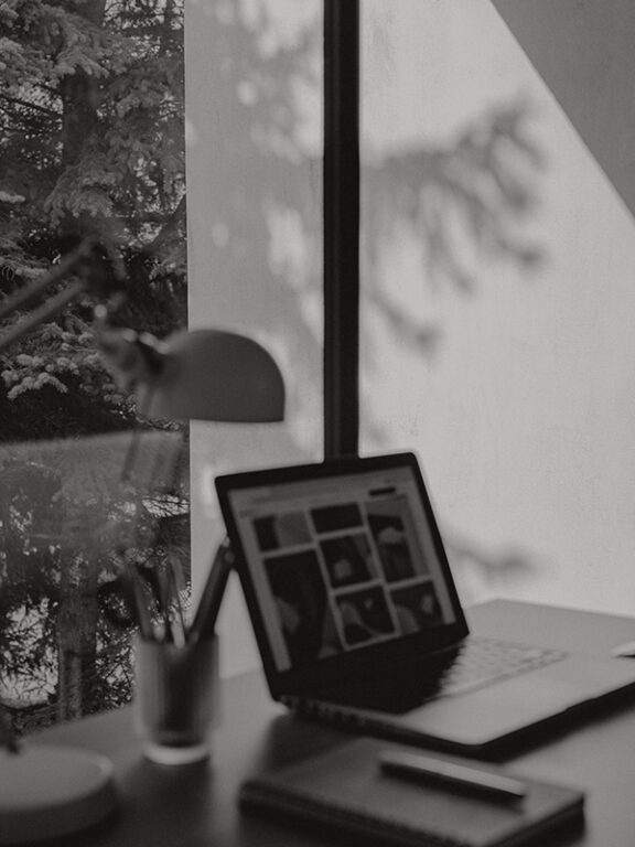 A laptop sitting on top of a desk.